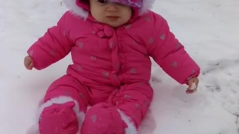 Baby experiences snow for the first time, has priceless reaction