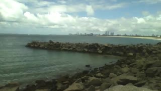 Recording the sea and the rocks, you can see the city on the horizon, beautiful [Nature & Animals]