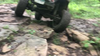 TJ Wrangler sideways of a rock ledge KROCKS