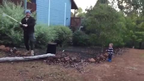 Toddler finds dad's wood chopping absolutely hilarious