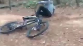 Guy in dirt bike falls on his side