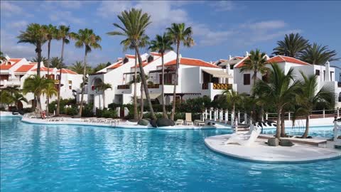 tenerife canary islands spain swimming pool in tropical hotel resort with palm trees for beach