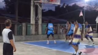 Basketball Player Accidently Runs Into Referee