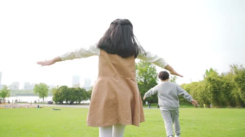 What a lovely, carefree child running on the grass