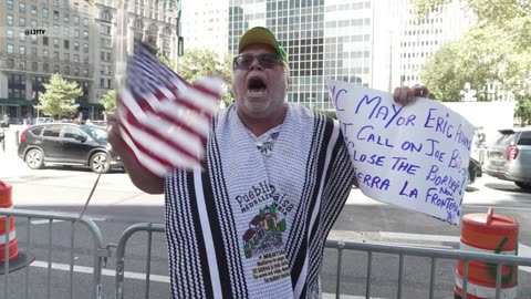 Protesters crash NYC mayor Eric Adams's migrant work authorization rally.
