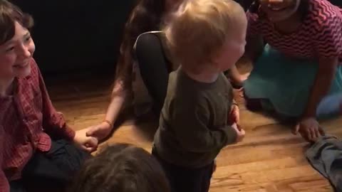 Toddler finds game of ring-around-the-rosy absolutely hysterical