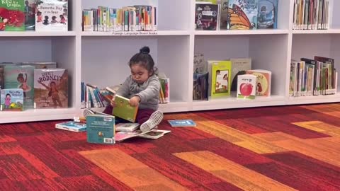 Kid enjoying in library