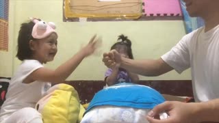 Daughters Play A Whimsical Game Of "Rock Scissors Paper" With Their Father