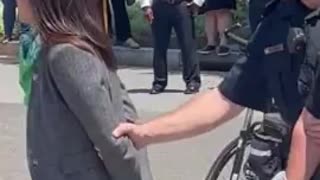 AOC Tries To Trick Crowd Into Thinking She's Handcuffed