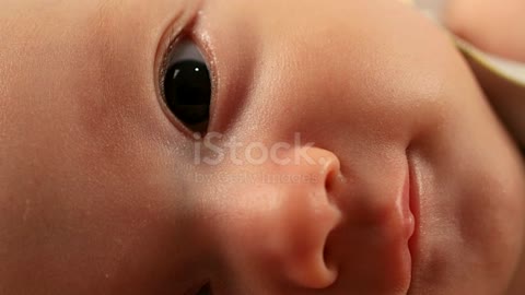 Newborn baby boy face close up of Eurasian ethnicity