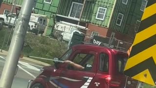 Tiny Car Crosses The Street