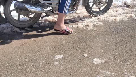 Bike and snow in village