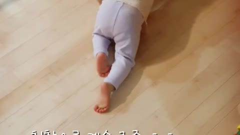 a floor-wiping baby