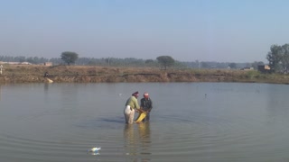 fisher catch the fish in the canal