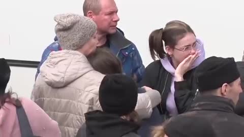 Russian men saying goodbye to their families and mobilizing