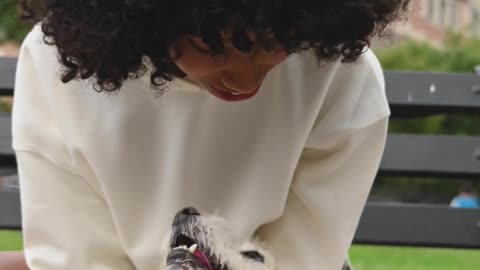 A Woman Petting a Dog