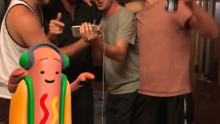 Guy karaoke singing with snapchat dancing hot dog