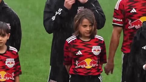 The wholesome moment new york red bulls take off their coats to give them to player escorts