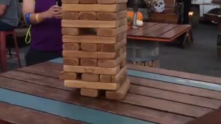 Guy pull out giant jenga block