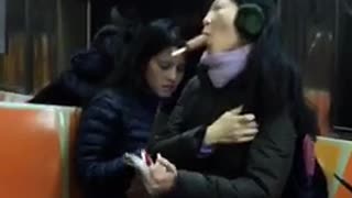 Woman suck brown popsicle no hands on subway