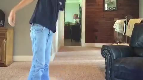 Blue shirt kid tries 180 jump on segway falls on carpet