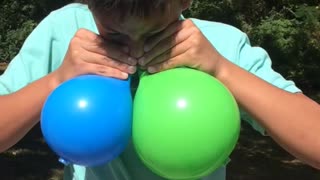 Boy Blows Up Two Balloons With Just His Nose