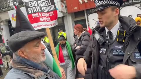 Protestor speaks with police about meaning of 'socialist intifada'