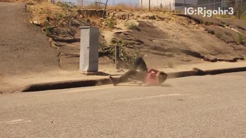Guy skateboard jump hill fail hits head on curb cement