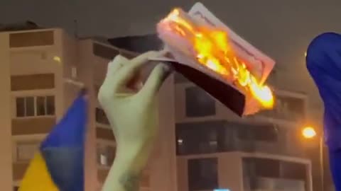 Russian citizens burning their passports in Tel Aviv in front of the Russian embassy