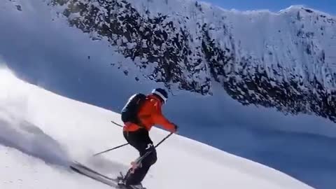 This videographer is shooting while skiing at 55 mph.