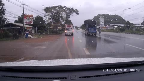 Truck Carrying Big Load Has Close Call on Slippery Road