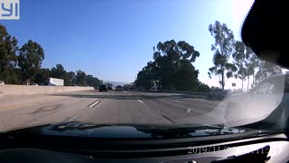 Truck's Wheel Goes Free on Freeway