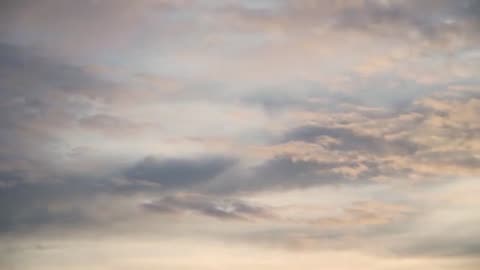 Piano music with choirs of voices and sound of rain.