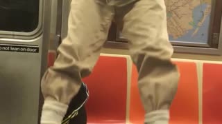 Older guy doing pull ups on subway
