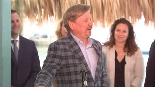 Governor Ron DeSantis stands beside small business owners like Jon LaBudde