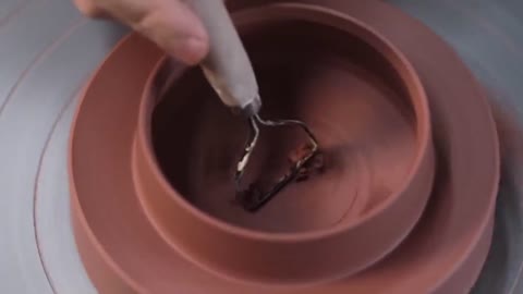 The Trimming Of The Bottom Of A Pottery Pot