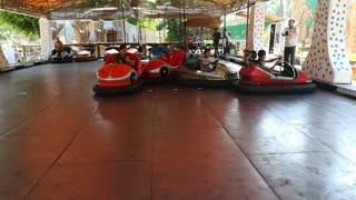 Electric Cars Entertain Kids In Park , Fun Time Park Cars
