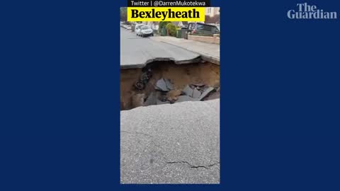 Residents peer into huge sinkhole in south-east London