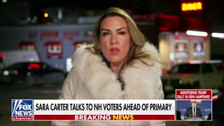 Sara Carter chats with New Hampshire voters as they prepare to cast their ballots
