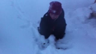 Carson Sliding Down a Slide and Throwing a Snowball at His Dad