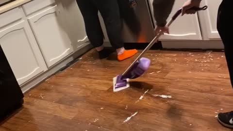 Spray Mop Sends Man Slipping and Sliding