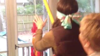 Blindfolded Woman Hits Lamp Instead Of Pinata
