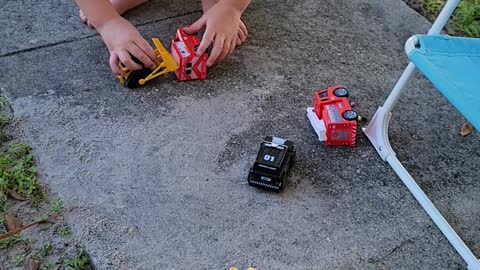 Theo loves the American Flag and playing with his construction and emergency vehicles!