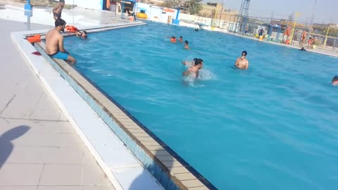 Children are swimming in the swimming pool