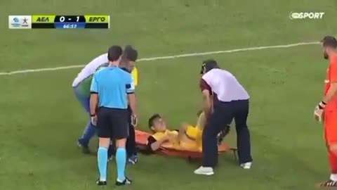 Clumsy medics try to carry a football player off the field