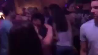 Music guy at bar making out with girl