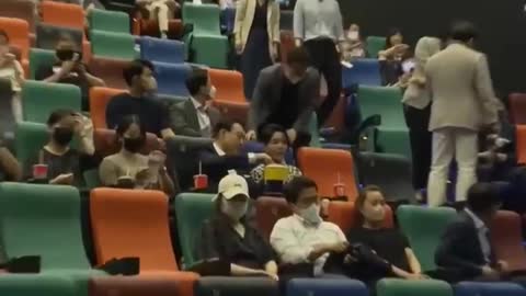 South Korean president and his wife take off masks and eat popcorn