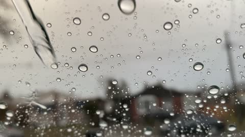 Rain Falling on Glass Window