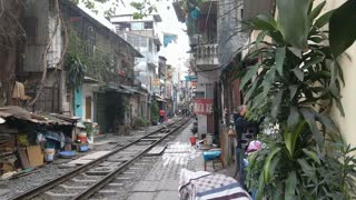 Incredible Footage Of A Train Passing Through Tiny Street In Hanoi, Vietnam