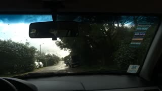 Guy slides down window in moving car